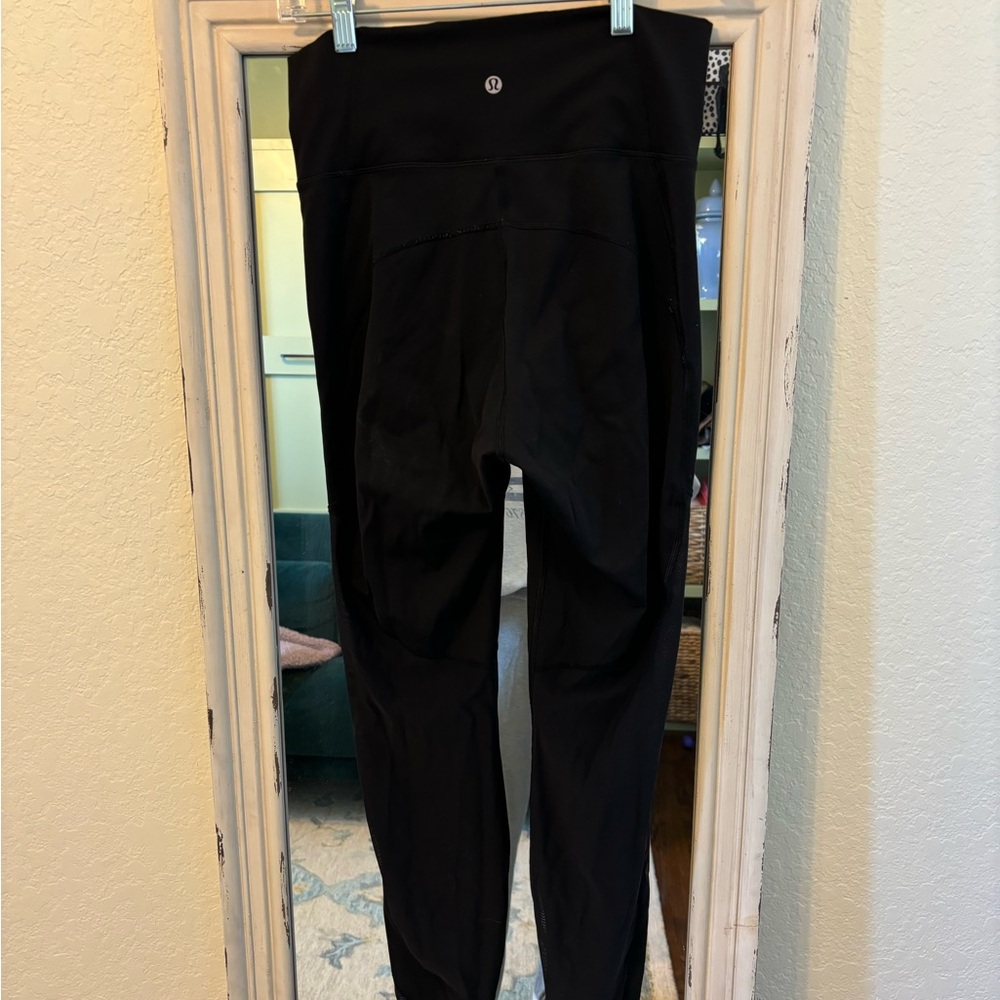 Lululemon black leggings with mesh on calves and ankle